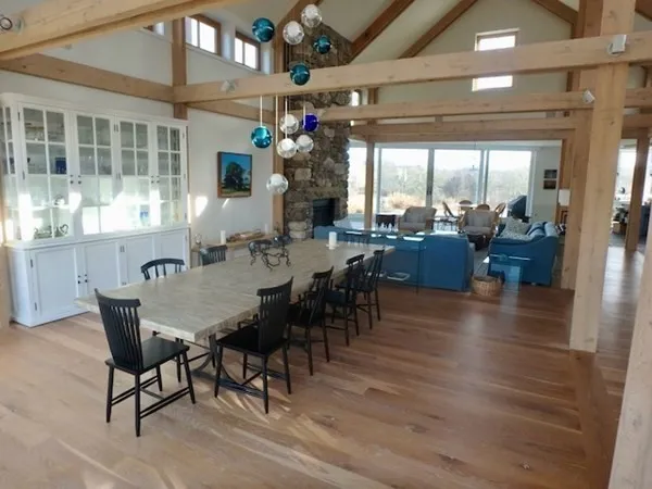 a view of a dining room with furniture window and outside view