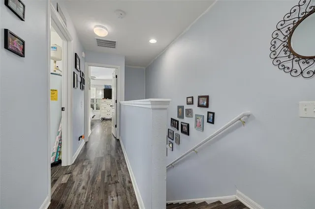 a view of a hallway with white walls