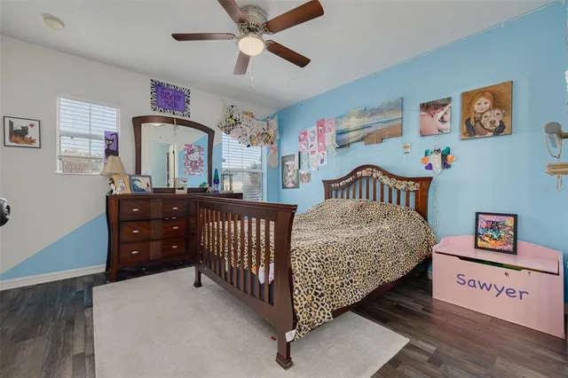 a bedroom with furniture and a window