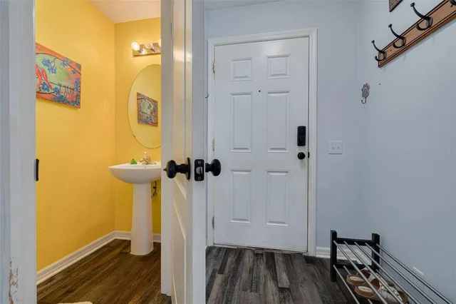 a view of a room with wooden floor