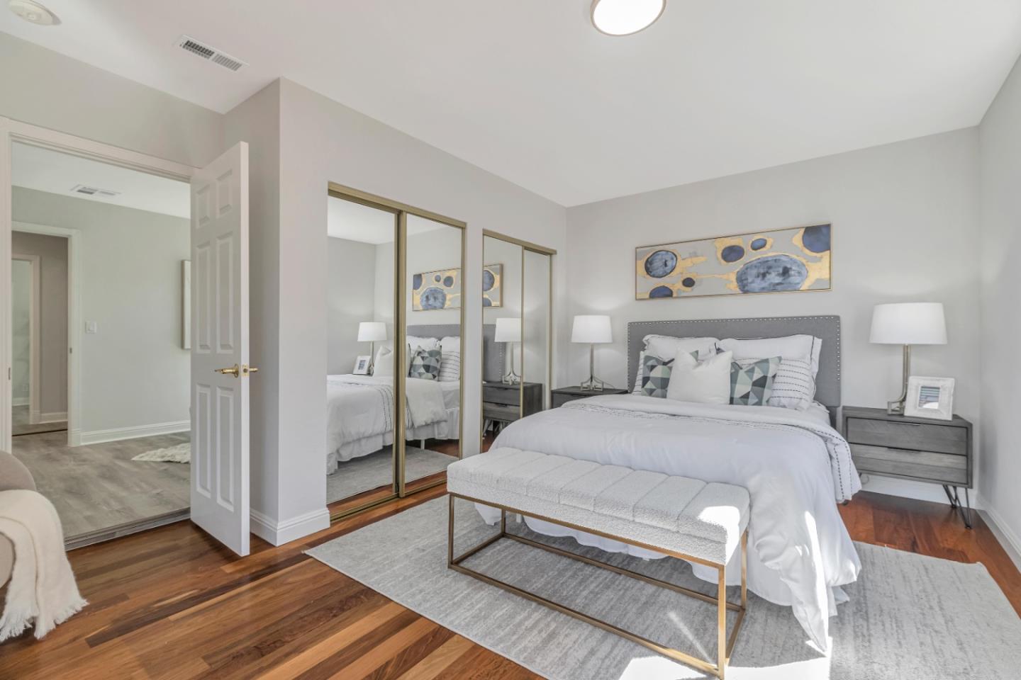 152 Brian Lane Santa Clara, CA 95051 - Photo 20 of 76 a spacious bedroom with a bed and wooden floor