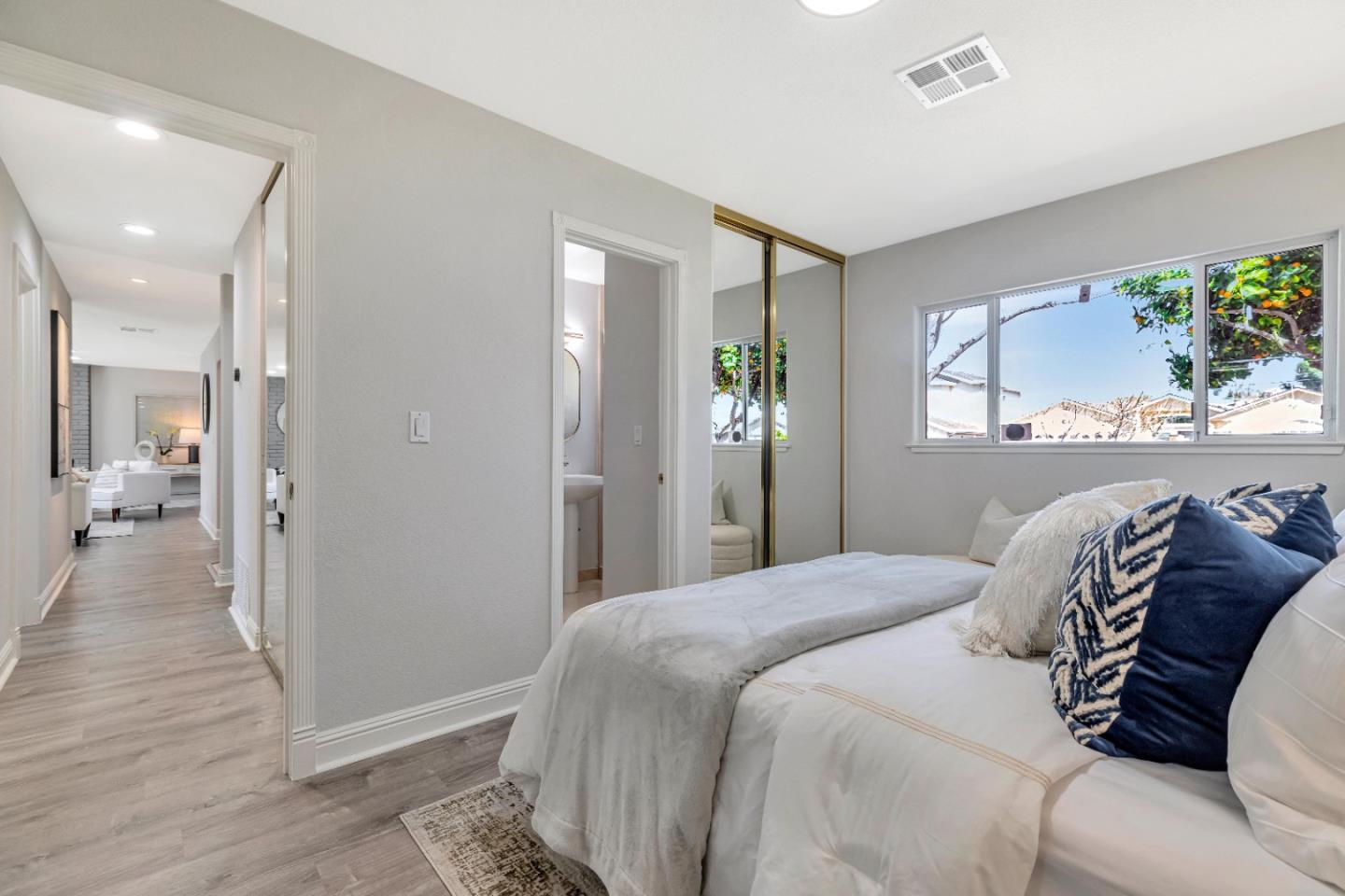 152 Brian Lane Santa Clara, CA 95051 - Photo 28 of 76 a bedroom with a balcony a bed and a painting on the wall