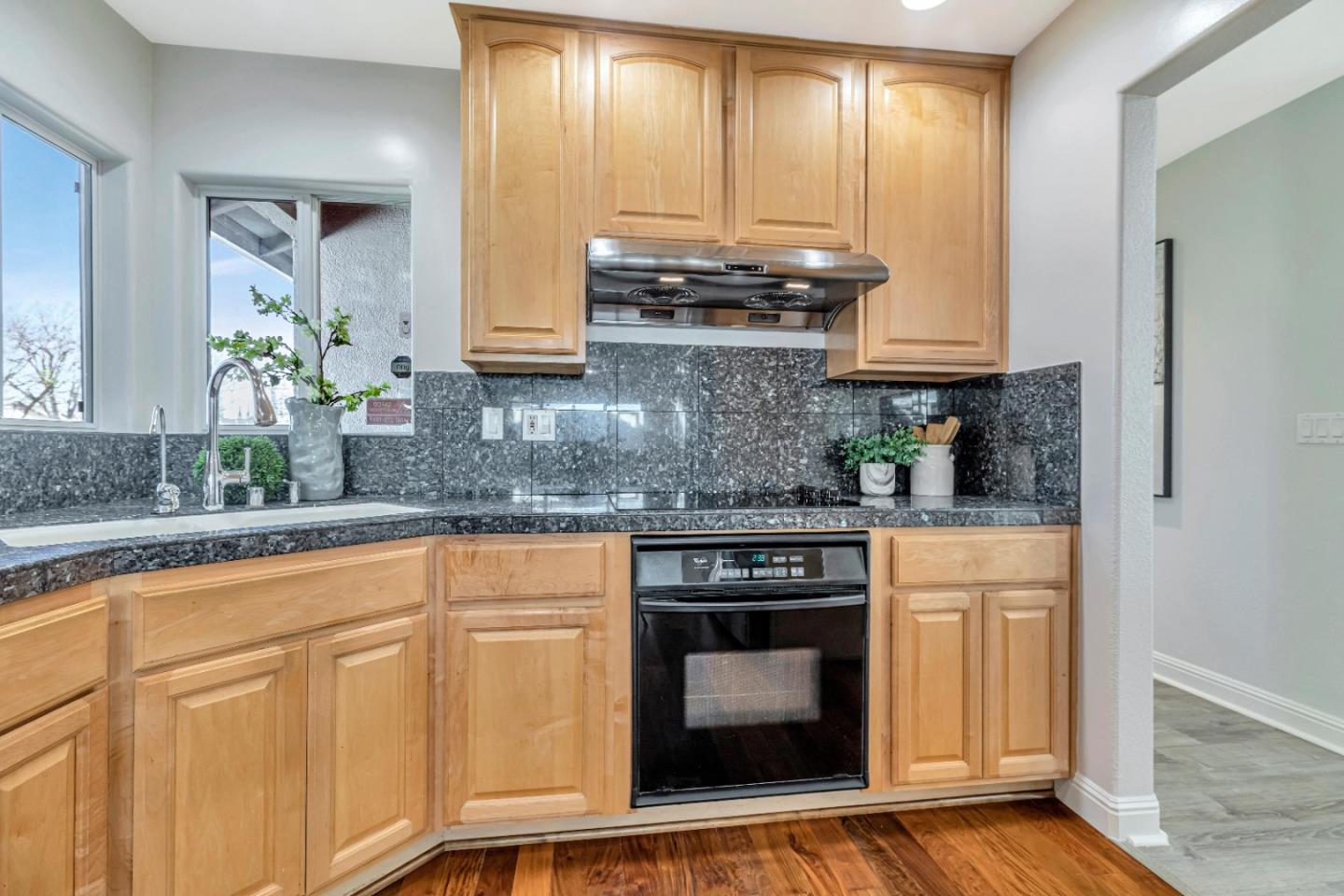 152 Brian Lane Santa Clara, CA 95051 - Photo 29 of 76 a kitchen with granite countertop a sink a stove and cabinets
