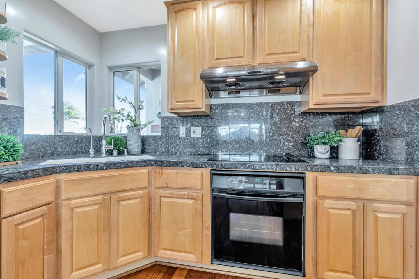 152 Brian Lane Santa Clara, CA 95051 - Photo 38 of 76 a kitchen with granite countertop white cabinets and white appliances