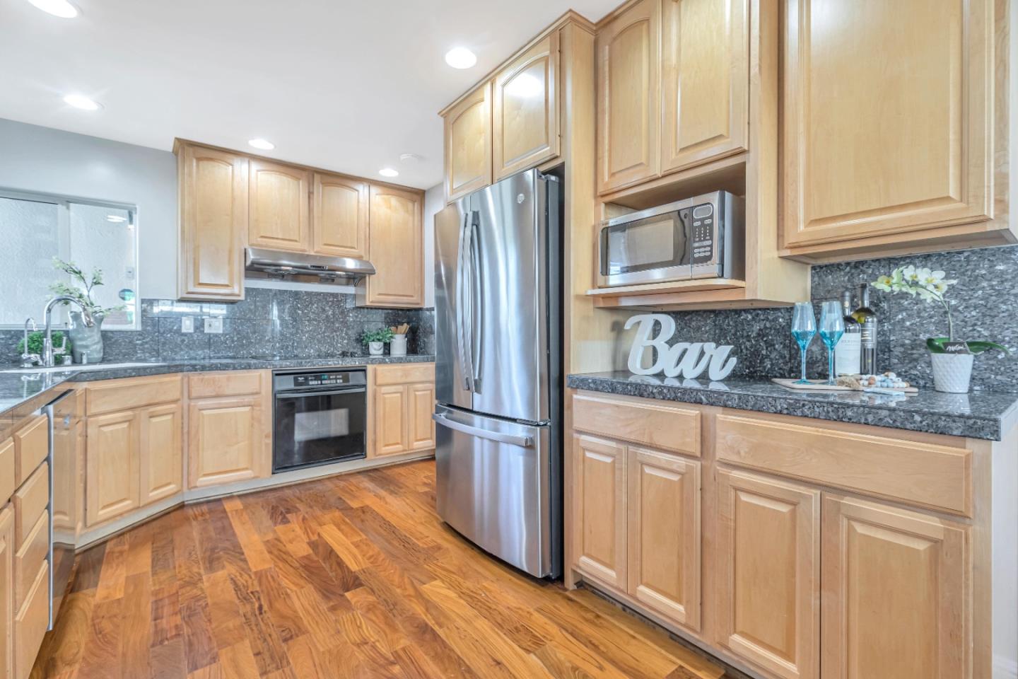 152 Brian Lane Santa Clara, CA 95051 - Photo 43 of 76 a kitchen with granite countertop a refrigerator stove top oven and sink