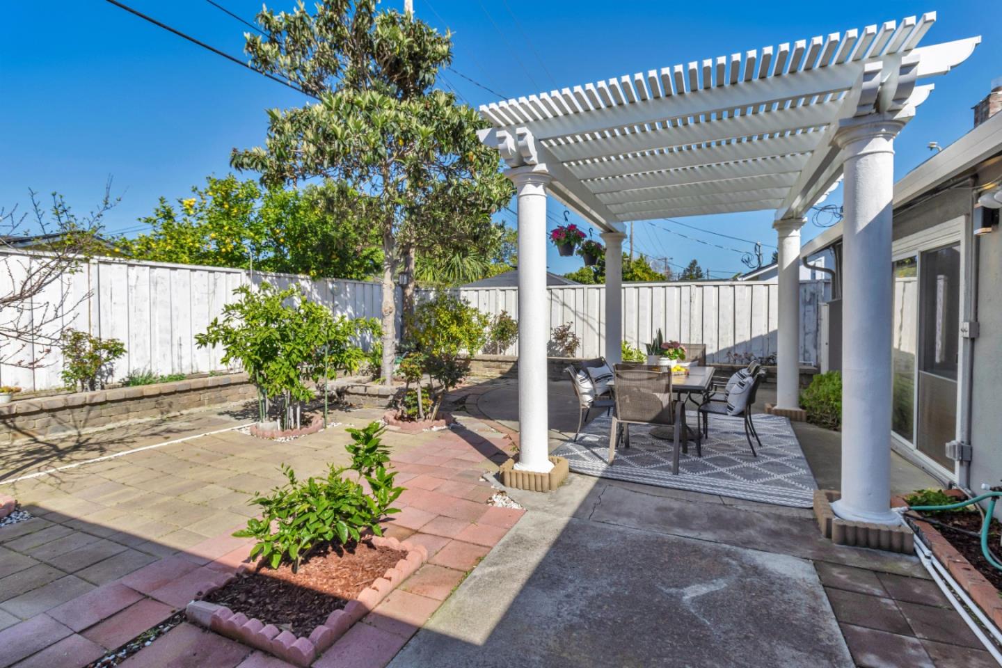 152 Brian Lane Santa Clara, CA 95051 - Photo 45 of 76 a view of a patio with table and chairs potted plants with wooden floor