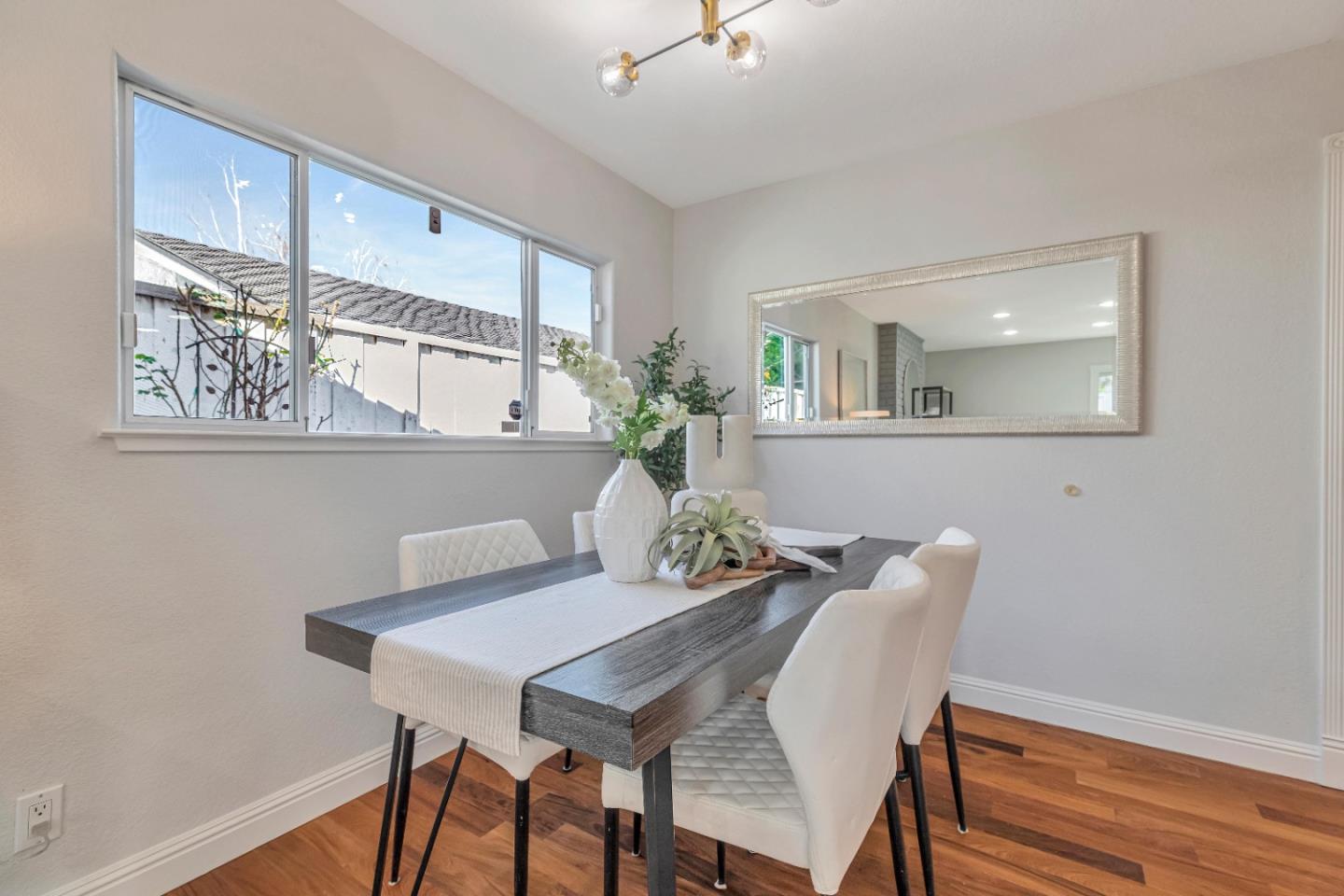 152 Brian Lane Santa Clara, CA 95051 - Photo 51 of 76 a view of a dining room with furniture and wooden floor