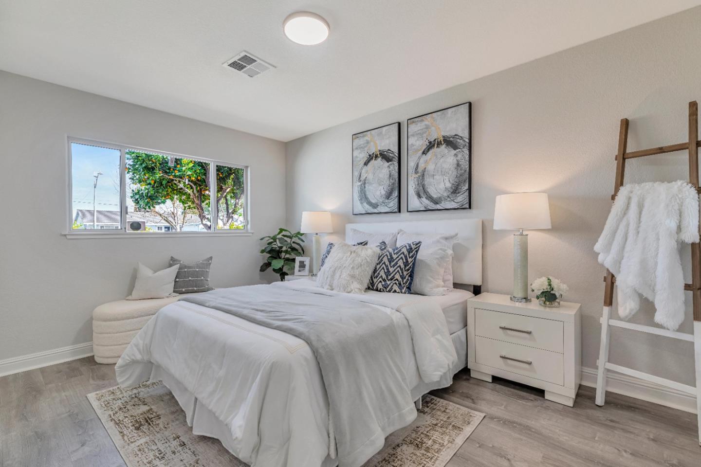 152 Brian Lane Santa Clara, CA 95051 - Photo 60 of 76 a bedroom with a bed and a painting on the wall