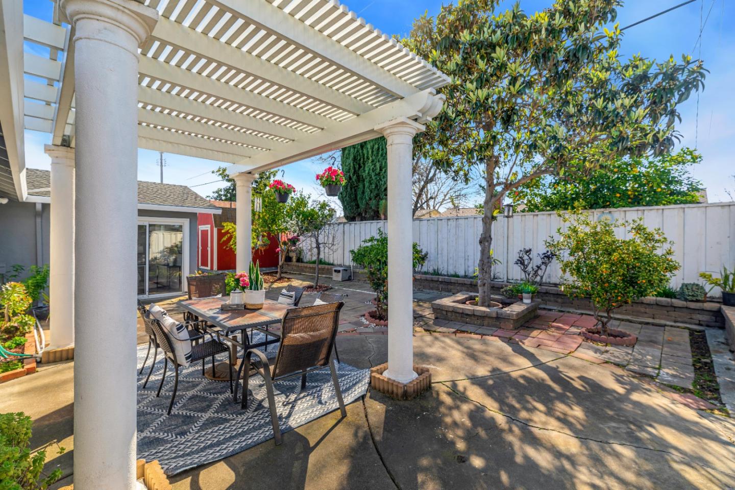 152 Brian Lane Santa Clara, CA 95051 - Photo 62 of 76 a view of a patio with table and chairs potted plants and floor to ceiling window