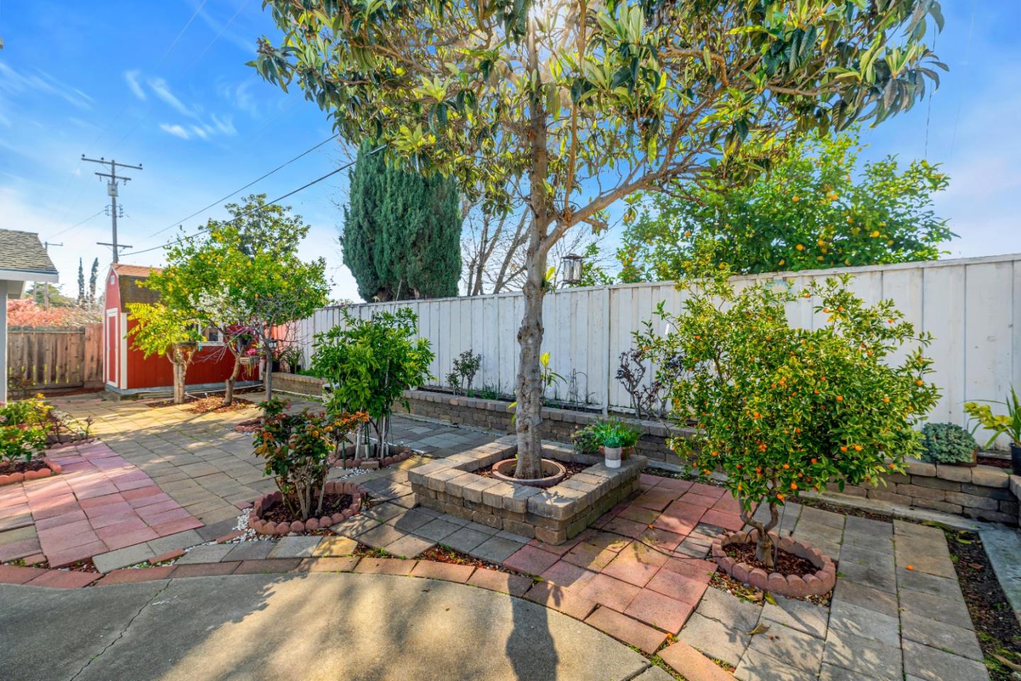 152 Brian Lane Santa Clara, CA 95051 - Photo 64 of 76 a backyard of a house with table and chairs plants