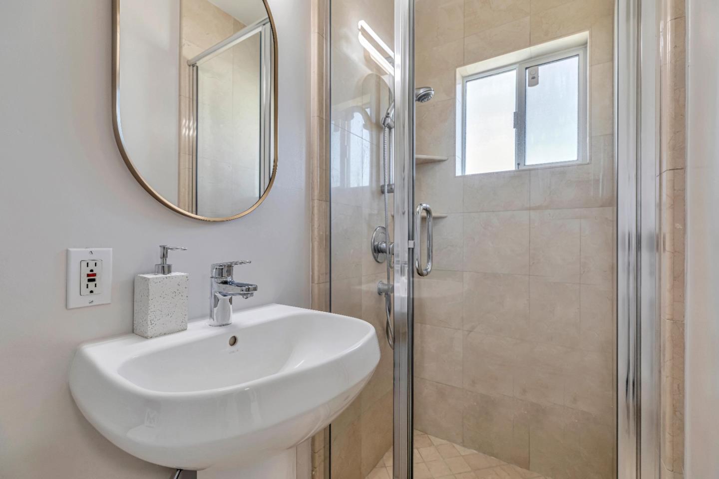 152 Brian Lane Santa Clara, CA 95051 - Photo 69 of 76 a bathroom with a sink a mirror and a shower