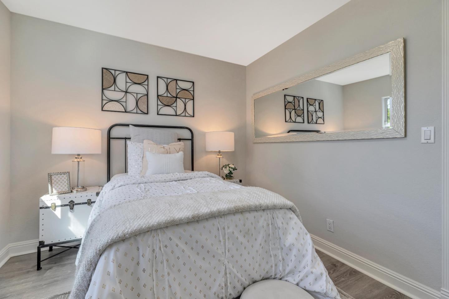 152 Brian Lane Santa Clara, CA 95051 - Photo 76 of 76 a bedroom with a bed and paintings on the wall