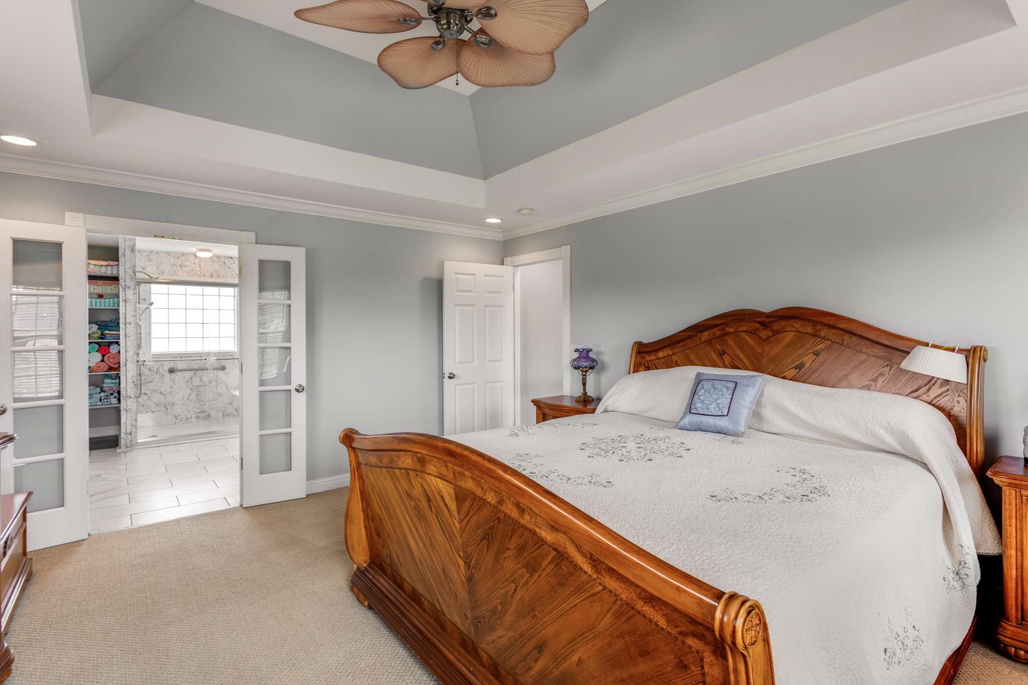 3600 Legacy Drive Springfield, TN 37172 - Photo 28 of 50 a bedroom with a bed and a chandelier