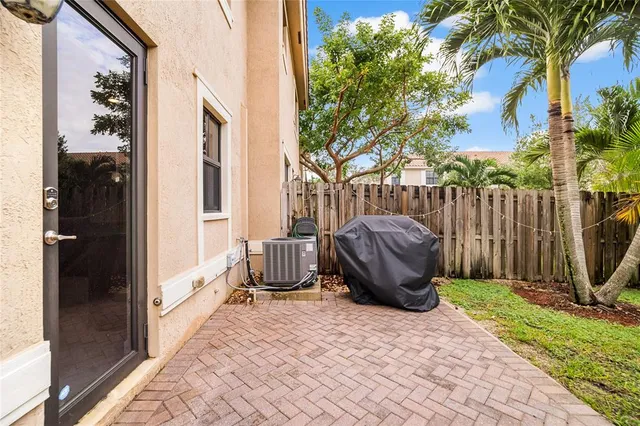 a view of a swimming pool with a patio