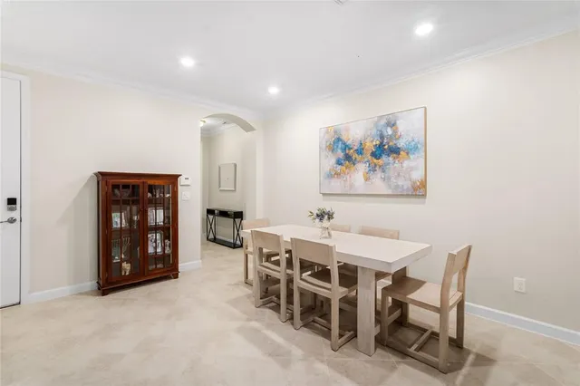 a view of a dining room with furniture and window