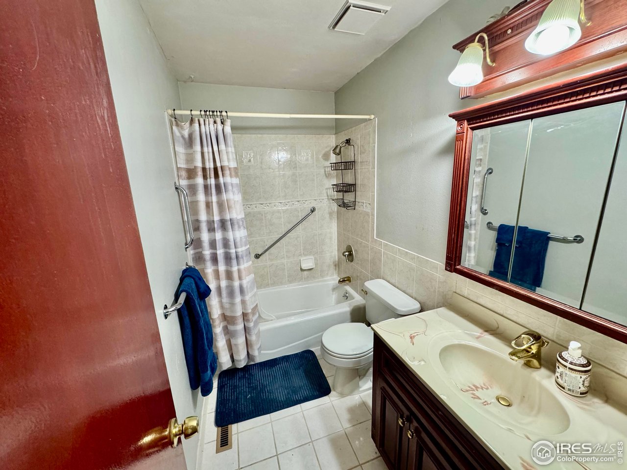 1924 30th Street Road Greeley, CO 80631 - Photo 12 of 19 a bathroom with a sink a toilet and tub