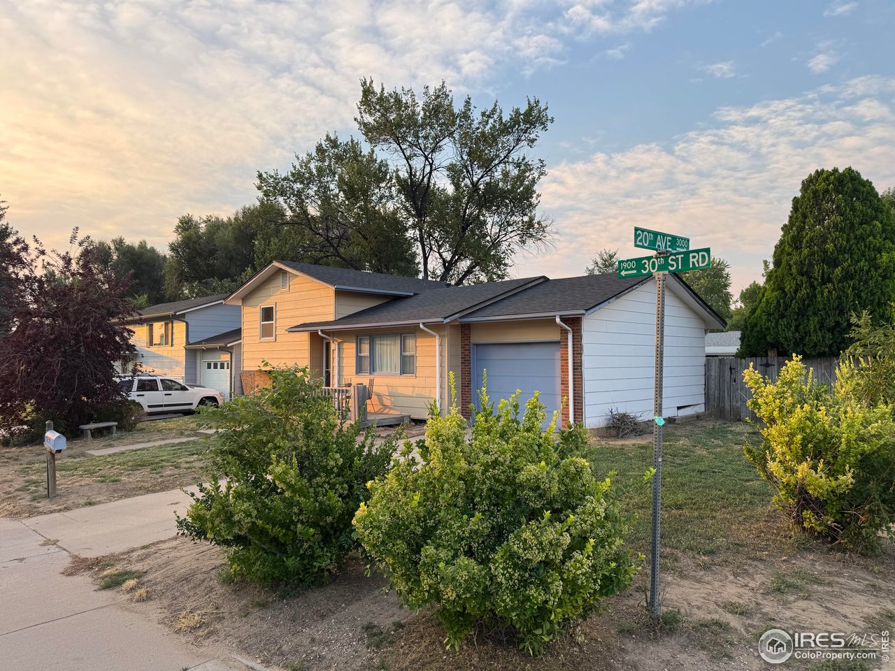 1924 30th Street Road Greeley, CO 80631 - Photo 18 of 19 a front view of a house with garden