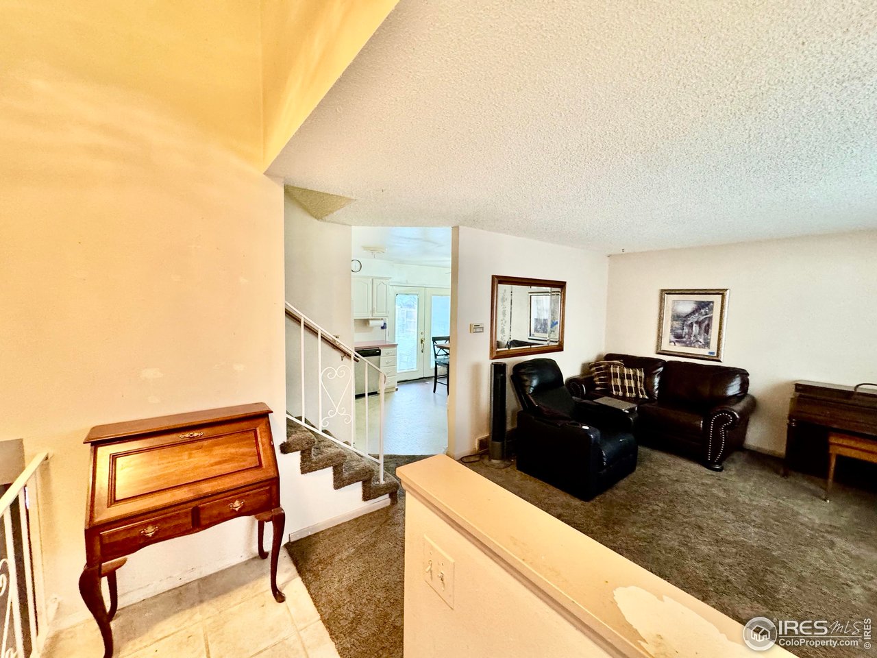 1924 30th Street Road Greeley, CO 80631 - Photo 2 of 19 a living room with furniture and a wooden floor