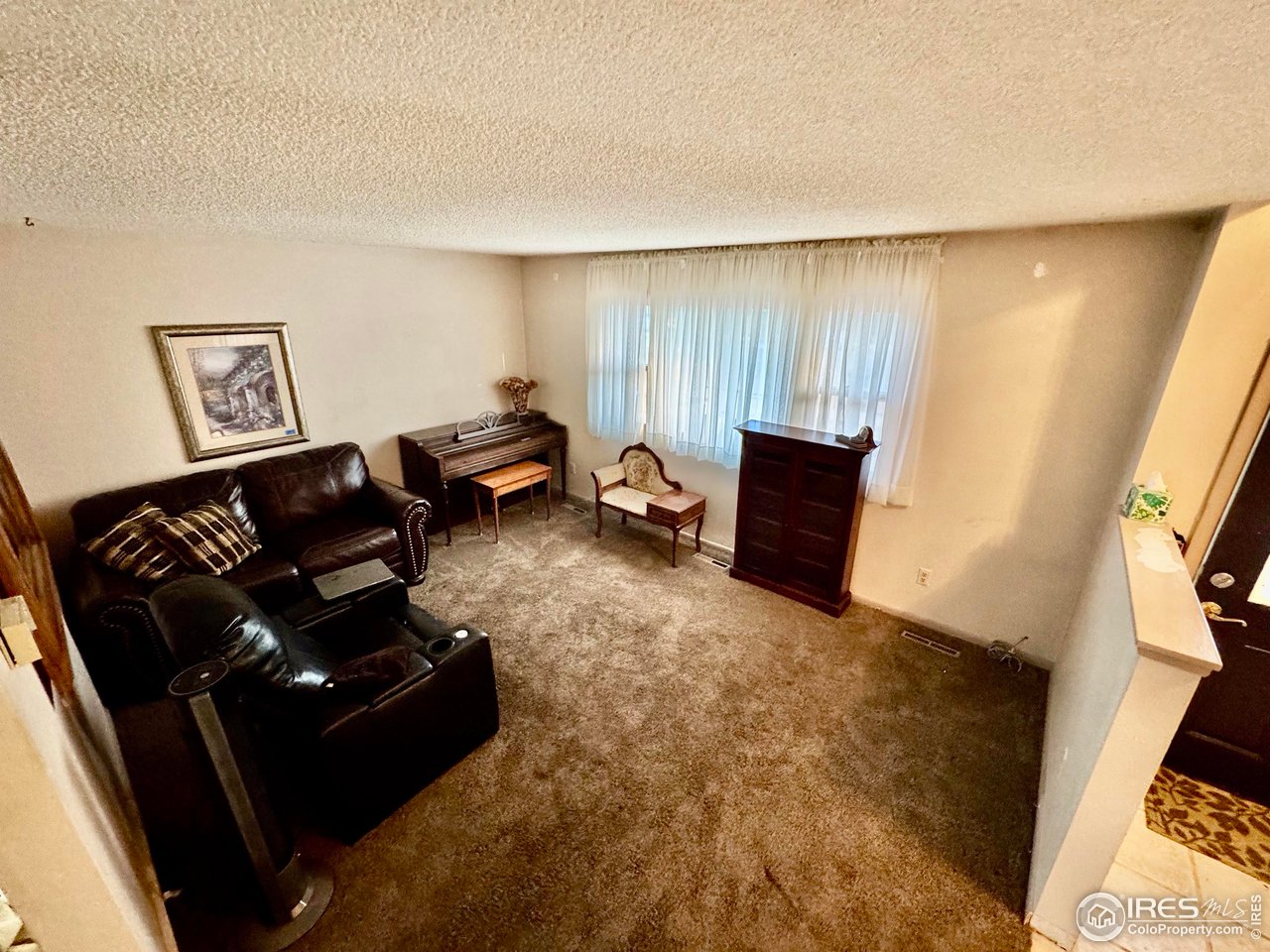 1924 30th Street Road Greeley, CO 80631 - Photo 4 of 19 a living room with furniture