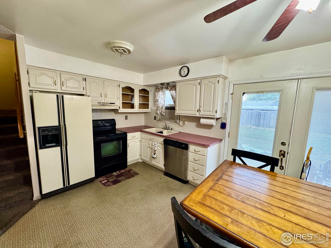 1924 30th Street Road Greeley, CO 80631 - Photo 7 of 19 a kitchen with a sink appliances and cabinets