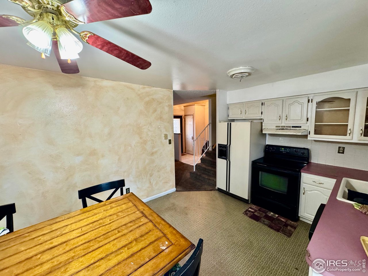 1924 30th Street Road Greeley, CO 80631 - Photo 10 of 19 a bedroom with a bed and dresser