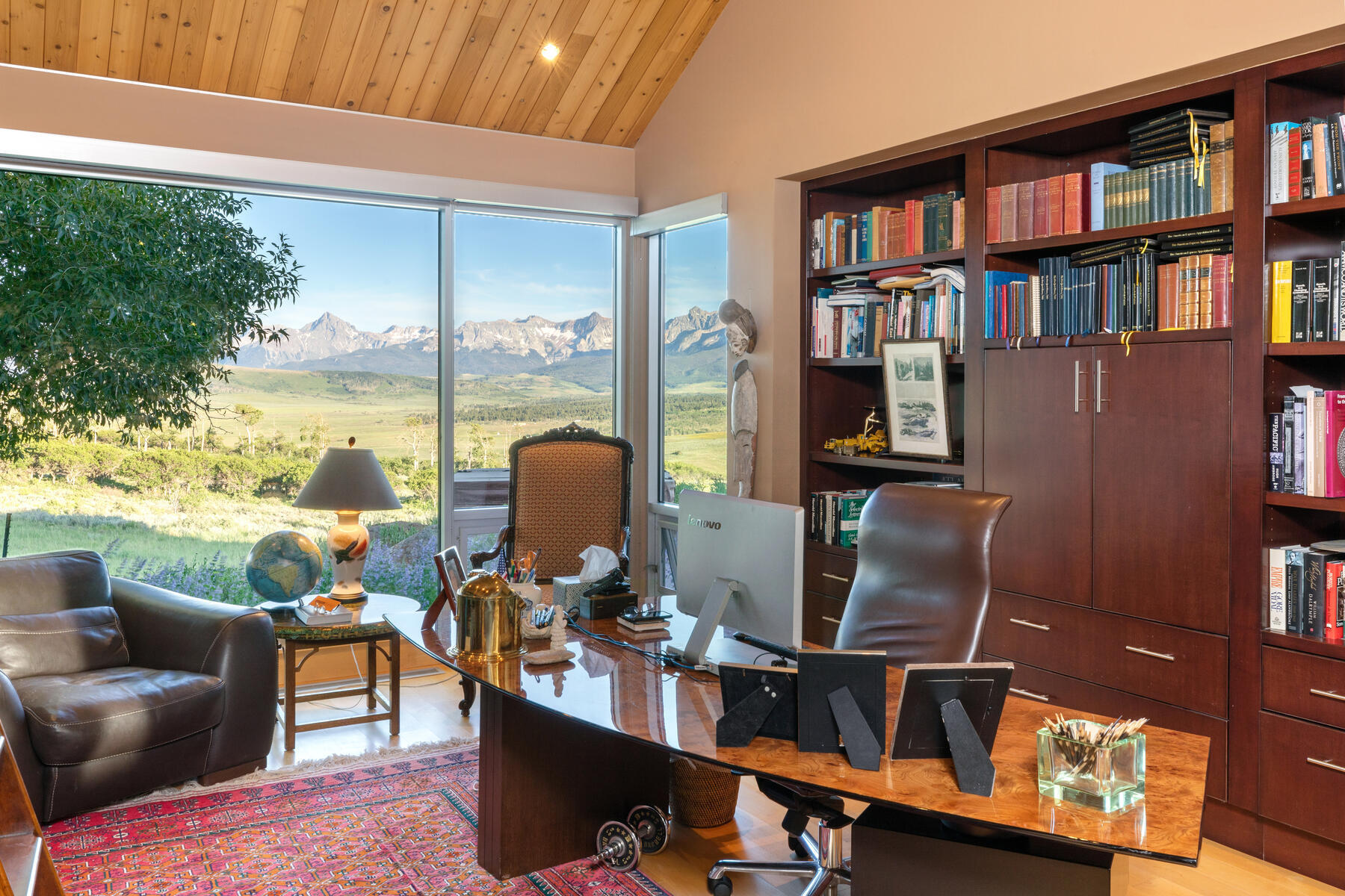 1804 Ranch Road Placerville, CO 81430 - Photo 17 of 52 a work room with furniture a bookshelf and a large window