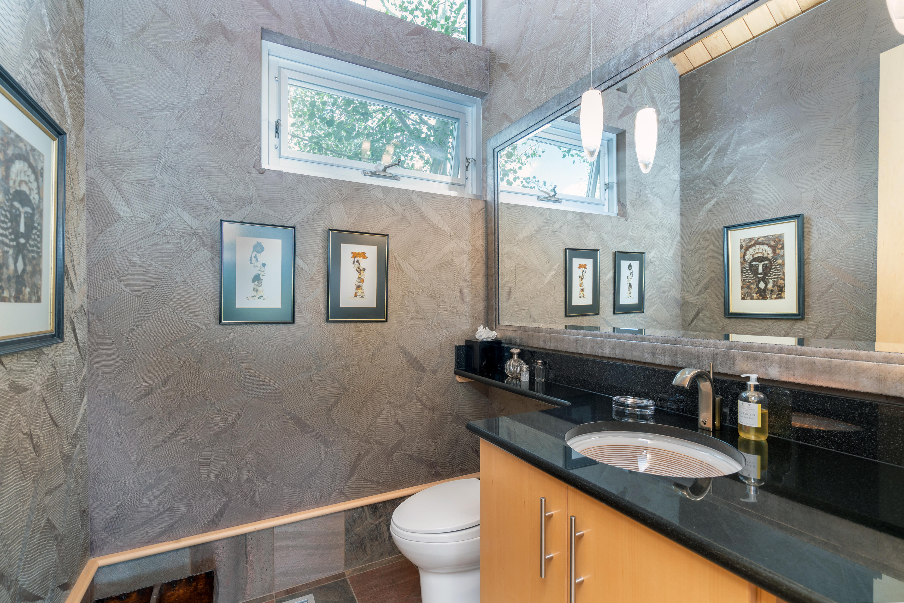 1804 Ranch Road Placerville, CO 81430 - Photo 24 of 52 a bathroom with a granite countertop toilet a sink and a large mirror