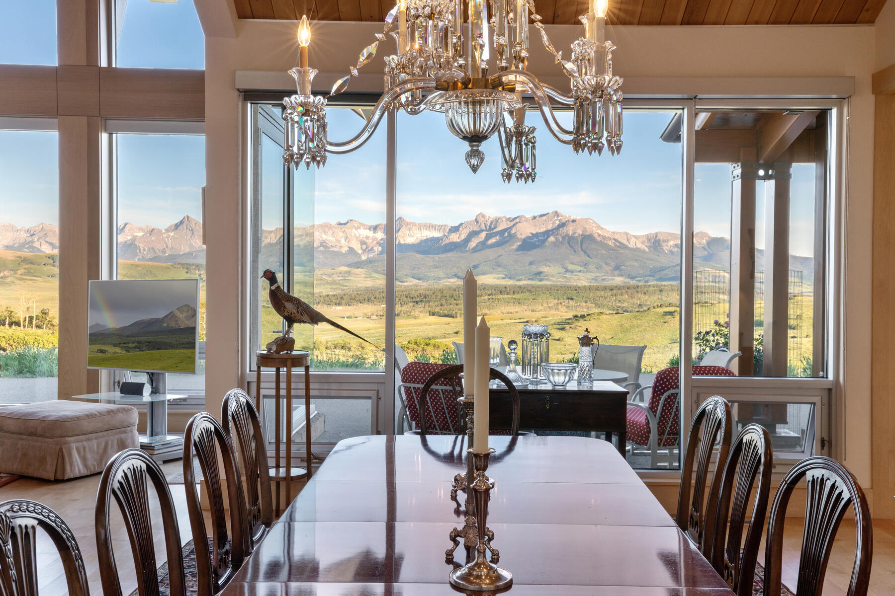 1804 Ranch Road Placerville, CO 81430 - Photo 4 of 52 a dining room with furniture water view and a chandelier