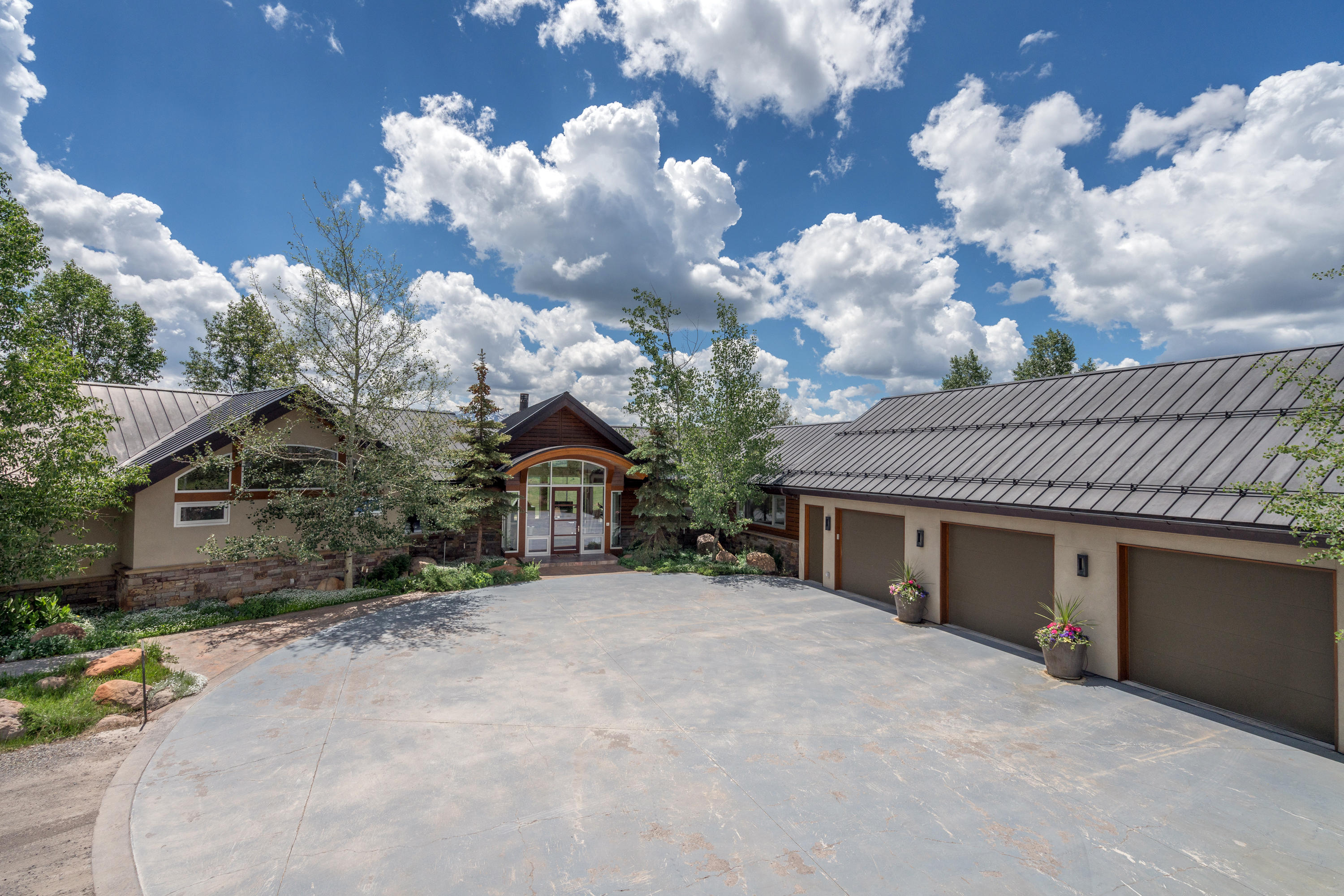 1804 Ranch Road Placerville, CO 81430 - Photo 38 of 52 a front view of a house with a yard and a garage