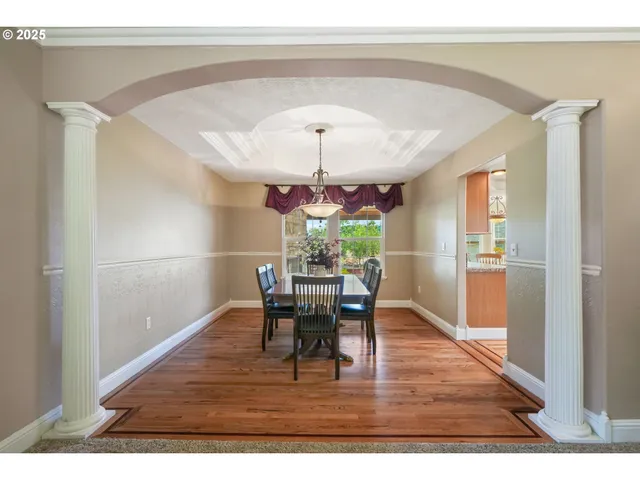 a view of a dining room with furniture and window