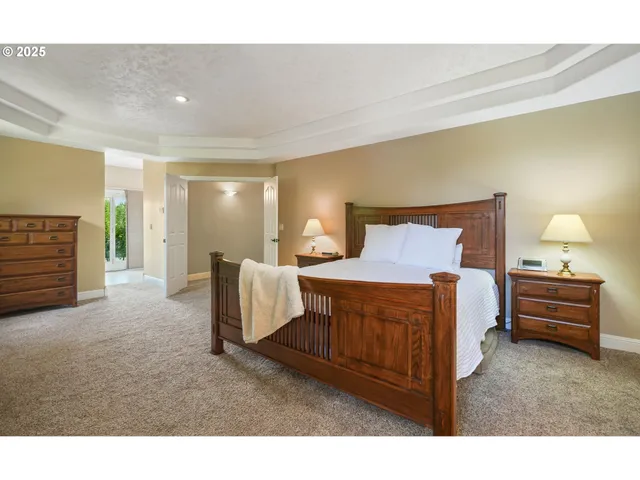 a spacious bedroom with a bed and a couch