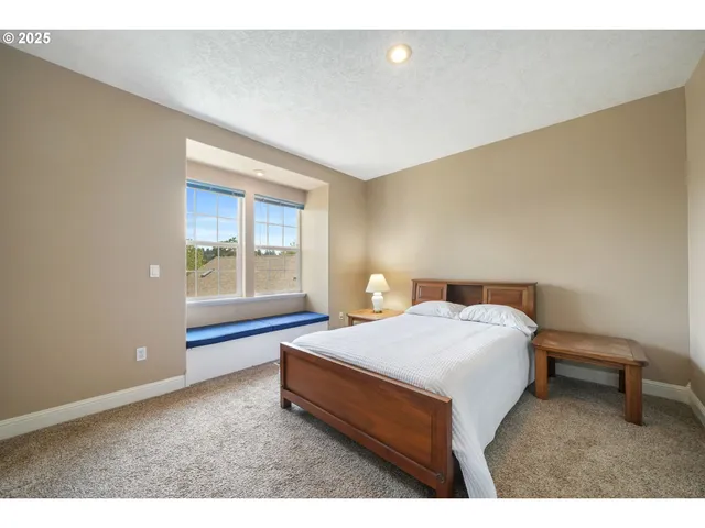 a bed room with a bed and a window