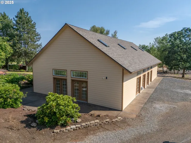 a view of a house with a yard and plants
