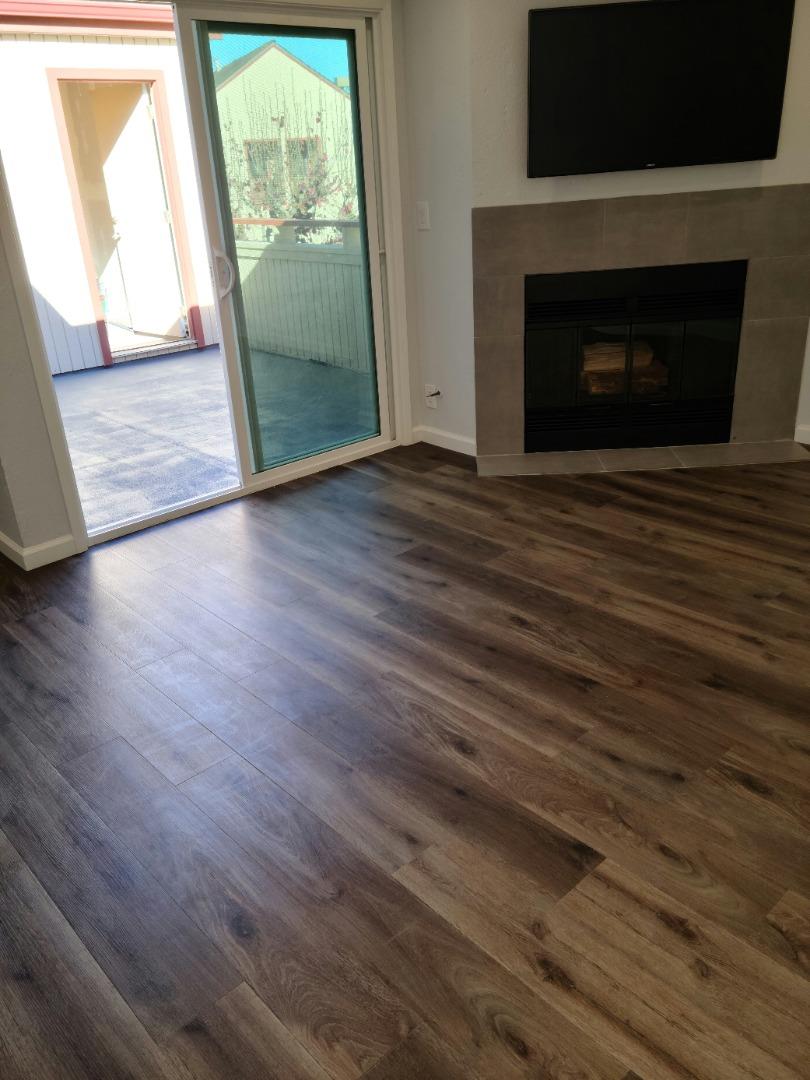 2362 North Main Street, Unit 6 Salinas, CA 93906 - Photo 2 of 21 a view of empty room with wooden floor and fireplace