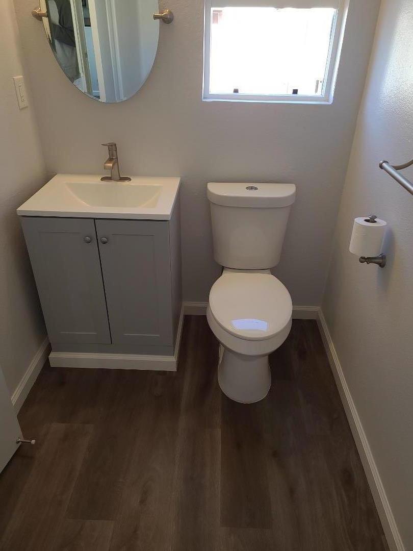 2362 North Main Street, Unit 6 Salinas, CA 93906 - Photo 3 of 21 a bathroom with a sink toilet and a mirror