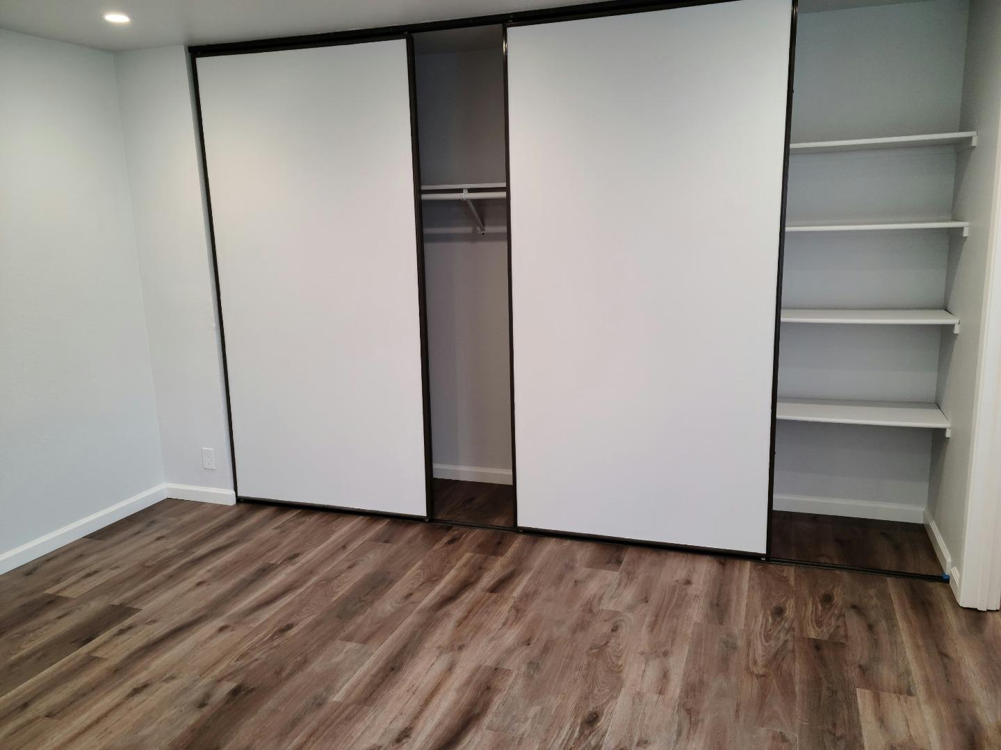 2362 North Main Street, Unit 6 Salinas, CA 93906 - Photo 4 of 21 a view of an empty room with wooden floor and closet