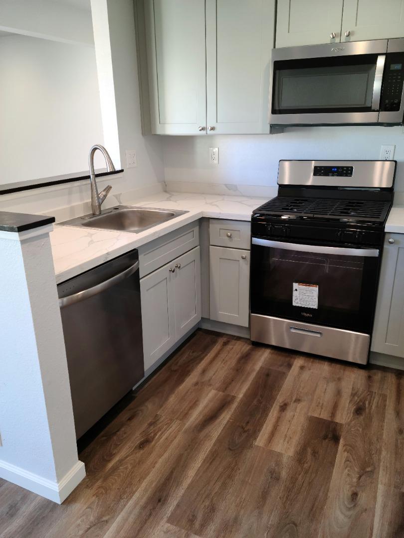 2362 North Main Street, Unit 6 Salinas, CA 93906 - Photo 5 of 21 a kitchen with sink a microwave and cabinets