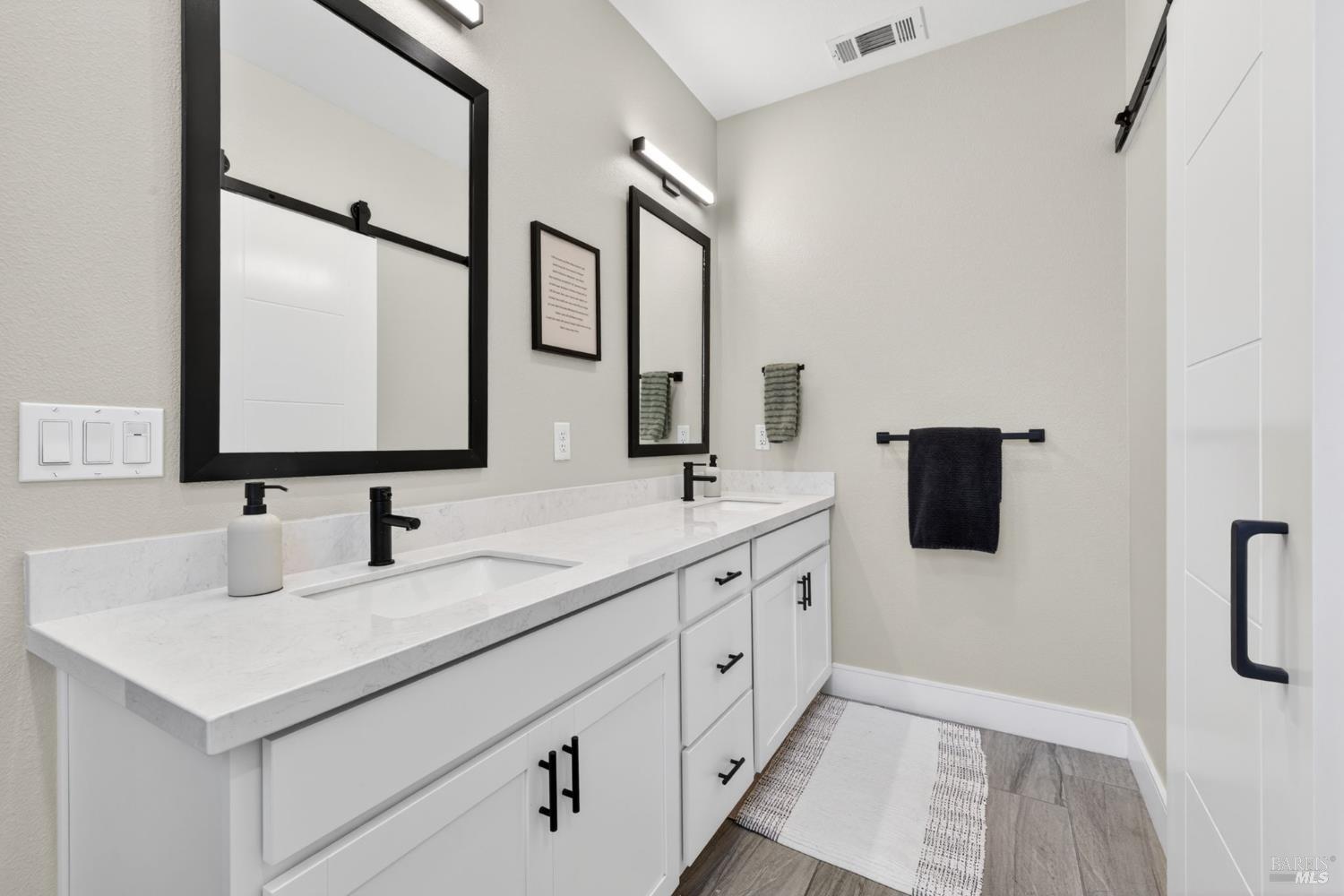 2215-2217 Versaro Drive Santa Rosa, CA 95403 - Photo 23 of 45 a bathroom with 2 sink and a mirror