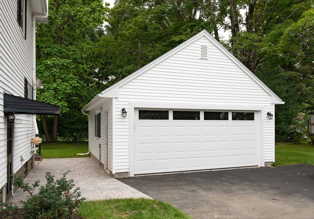 197 Bridge Road Northampton, MA 01062 - Photo 3 of 24 a view of a white house with a small yard