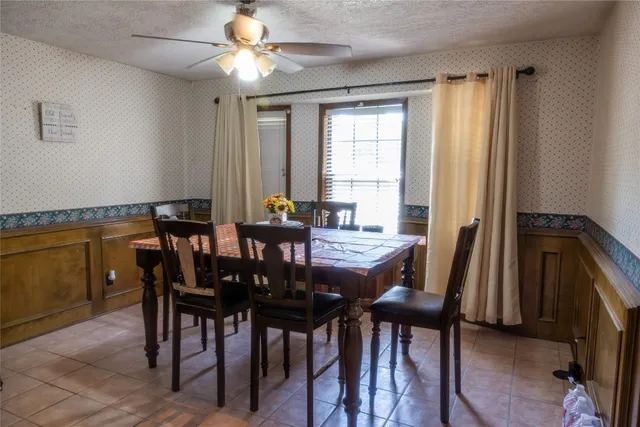 a view of a dining room with furniture and window