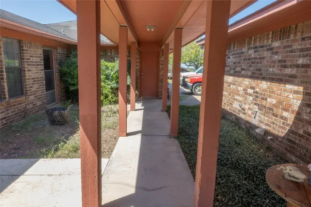 a view of a park with large trees