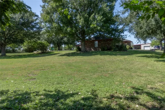 a view of a lake and a yard