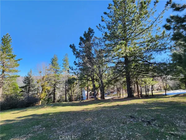 a view of a playground with basketball court