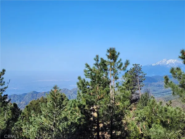 an aerial view of a houses with a yard