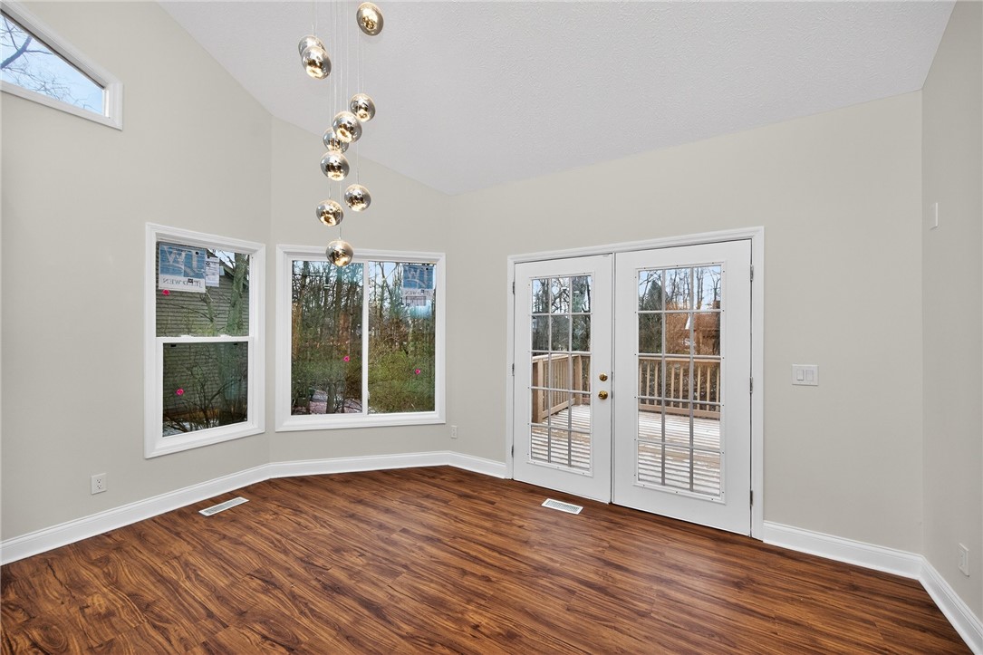 811 Wind Bluff Point Springboro, OH 45066 - Photo 8 of 51 This bright space features high ceilings, rich wood flooring, and French doors leading to an outdoor deck.