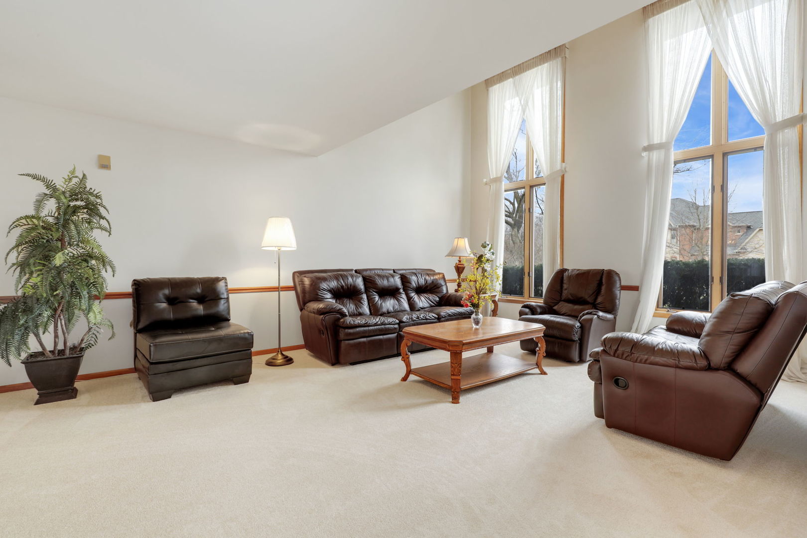 780 94th Street Burr Ridge, IL 60527 - Photo 13 of 53 a living room with furniture a flat screen tv and a large window