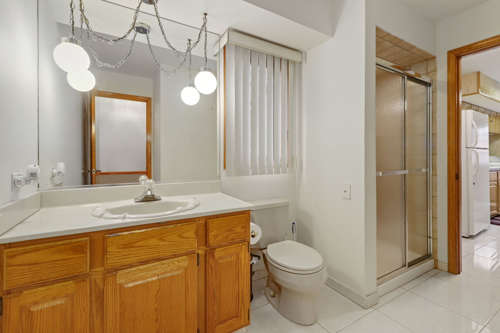 780 94th Street Burr Ridge, IL 60527 - Photo 16 of 53 a bathroom with a granite countertop sink toilet and shower