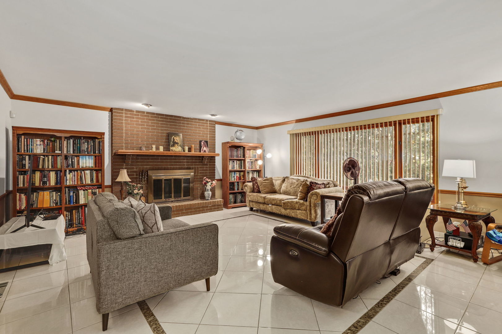 780 94th Street Burr Ridge, IL 60527 - Photo 2 of 53 a living room with fireplace furniture and a large window