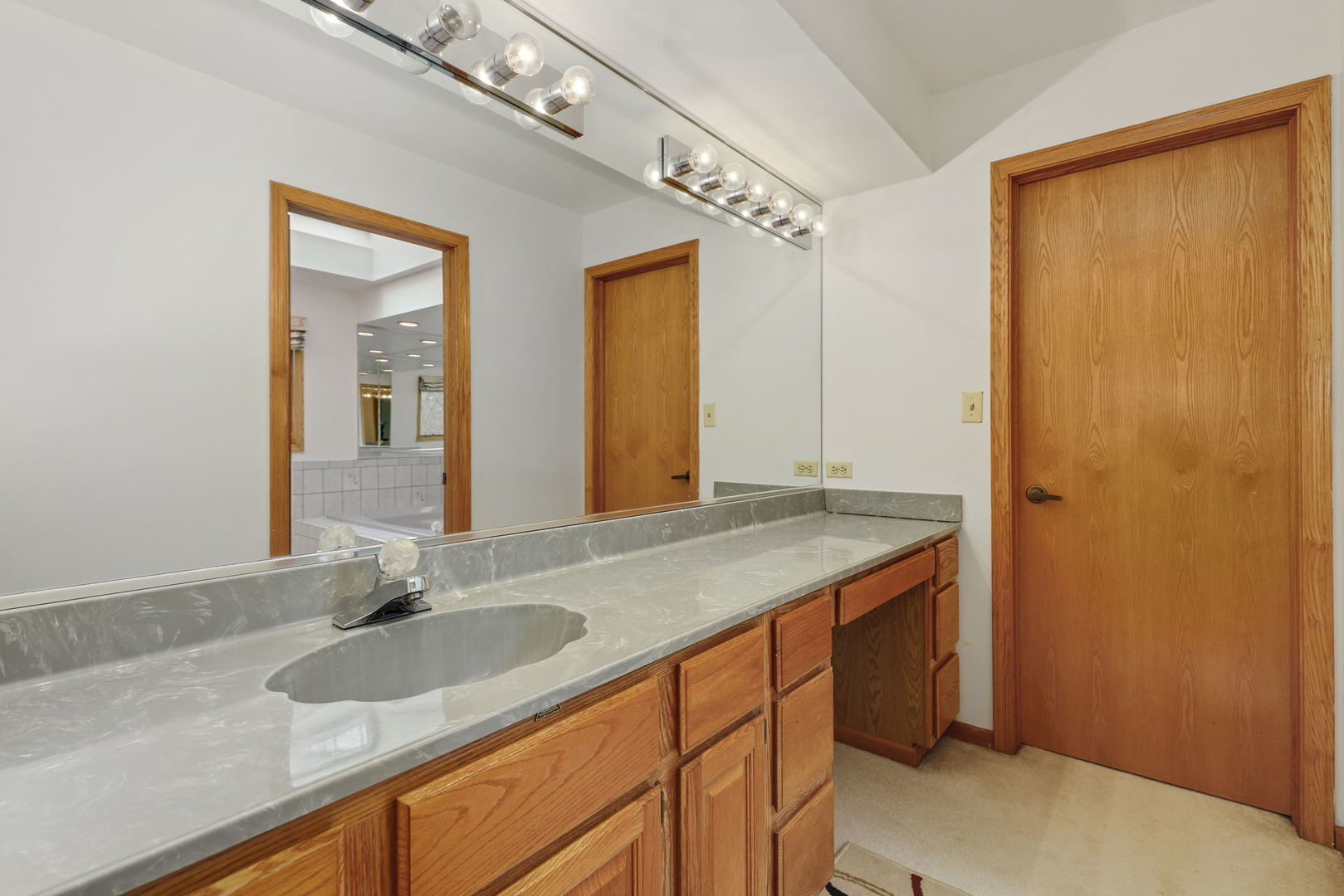 780 94th Street Burr Ridge, IL 60527 - Photo 23 of 53 a bathroom with a granite countertop sink and a mirror
