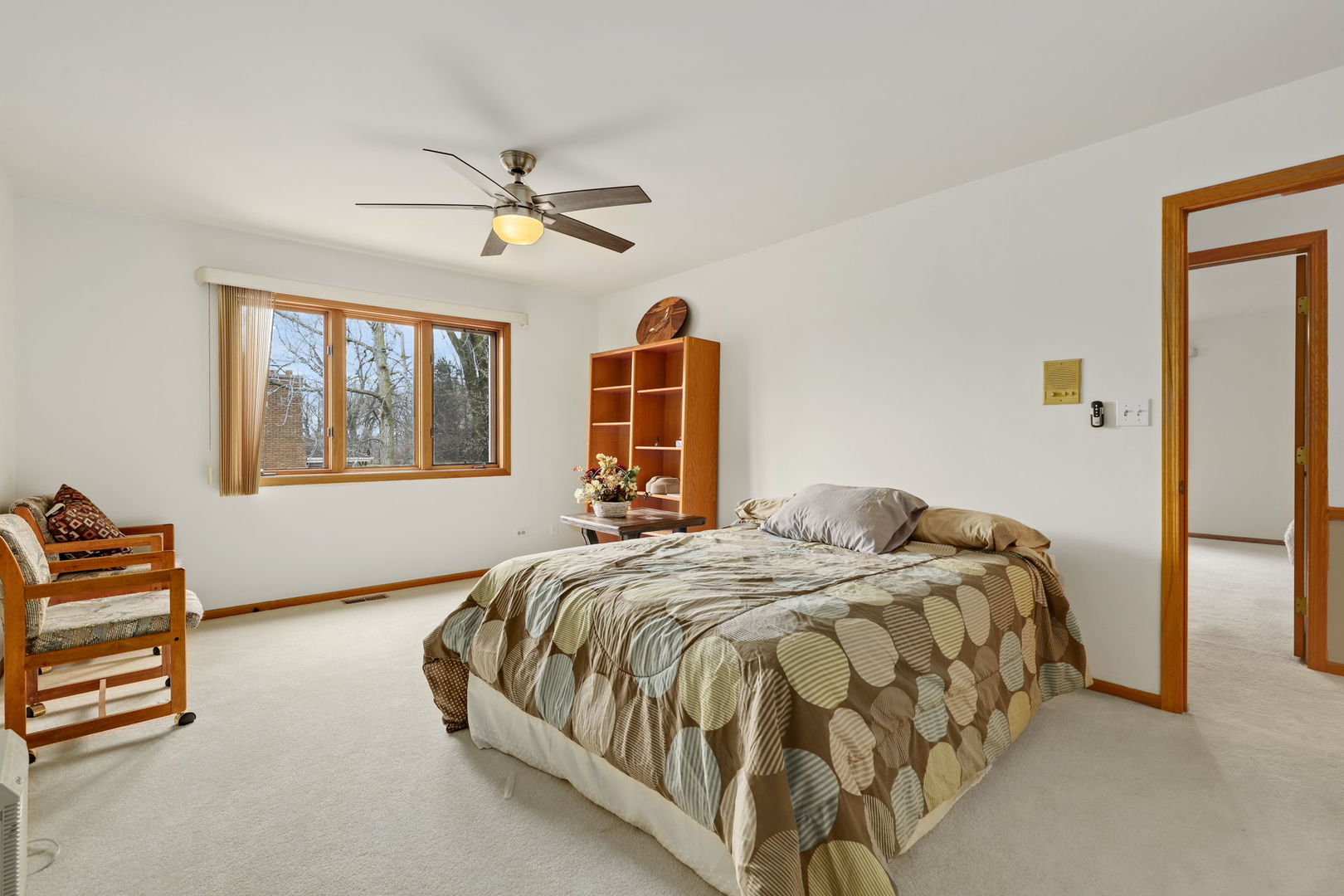780 94th Street Burr Ridge, IL 60527 - Photo 26 of 53 a bedroom with a bed and dresser with mirror